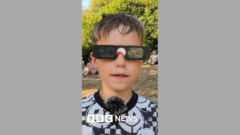 Boy, 8, enjoys historic solar eclipse