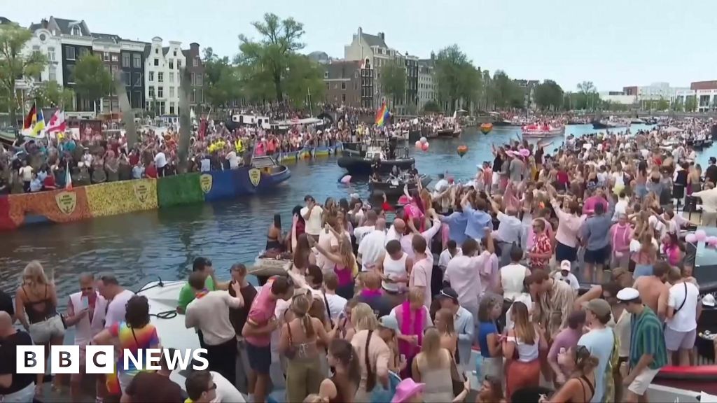 Crowds line Amsterdam’s canals for Pride boat parade