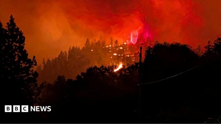 Fast-moving Canada wildfire doubles in size forcing thousands to flee homes