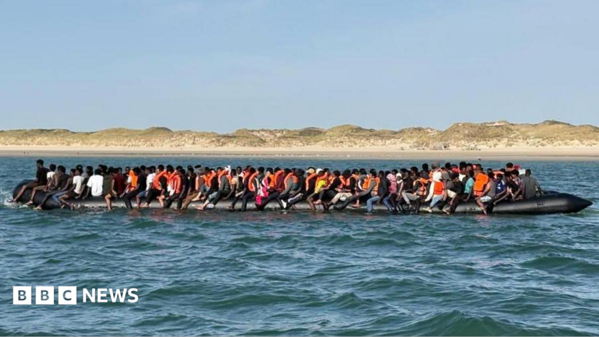 Record 230 people cross Channel in one small boat