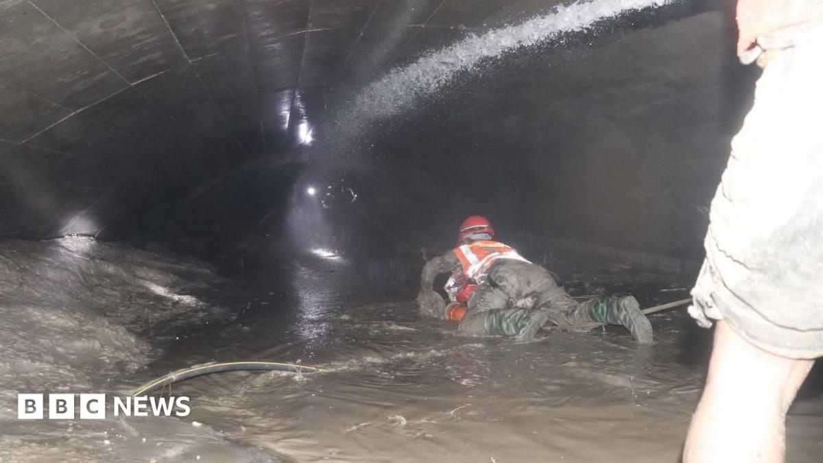 Nepal rescuers try to reach dozens trapped in tunnel after two found alive