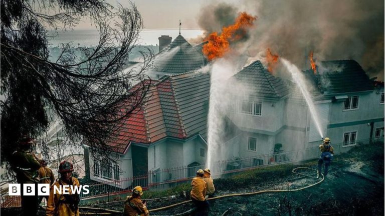 Evacuation orders as fast-moving California wildfire burns homes